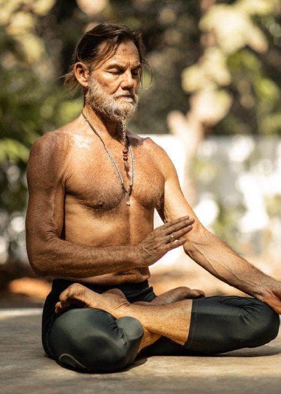 John Scott seated in lotus posture during meditation